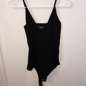 black bodysuit with cross-chest